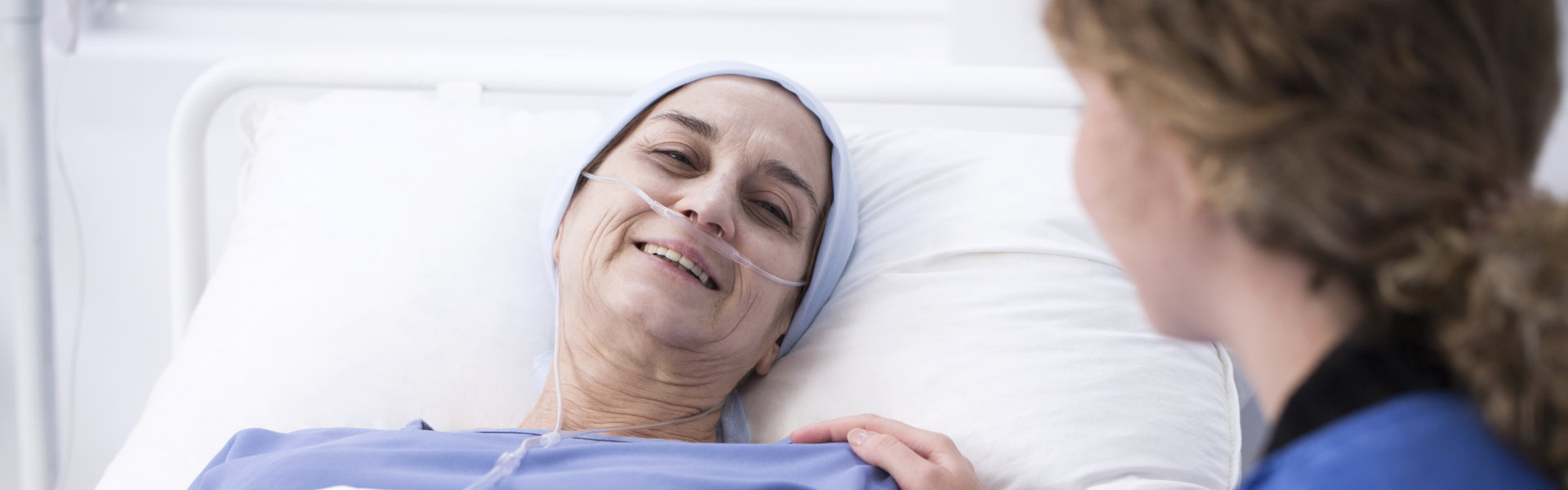 woman sitting and senior in bed