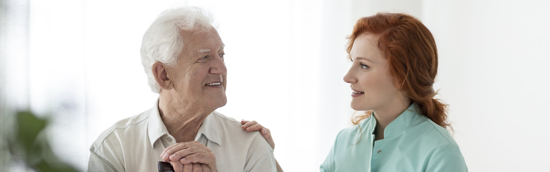 caregiver and patient man talking